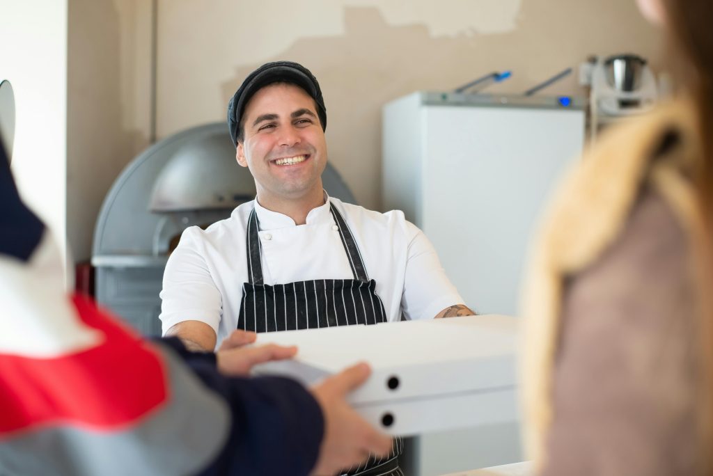 A professional chef preparing and serving vegetarian luncheon meat dishes