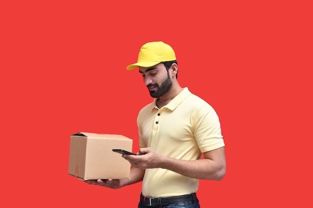 A delivery man holding a package representing international grocery shipping to the USA